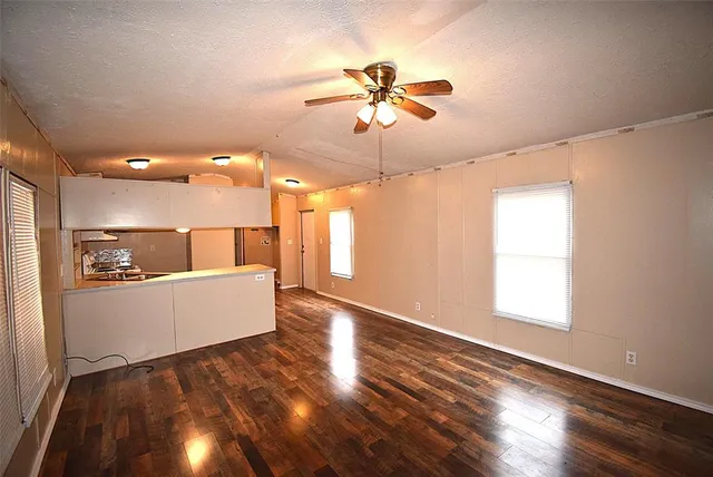 a view of kitchen with wooden floor and window