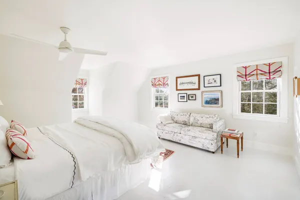 a bedroom with a bed and a couch