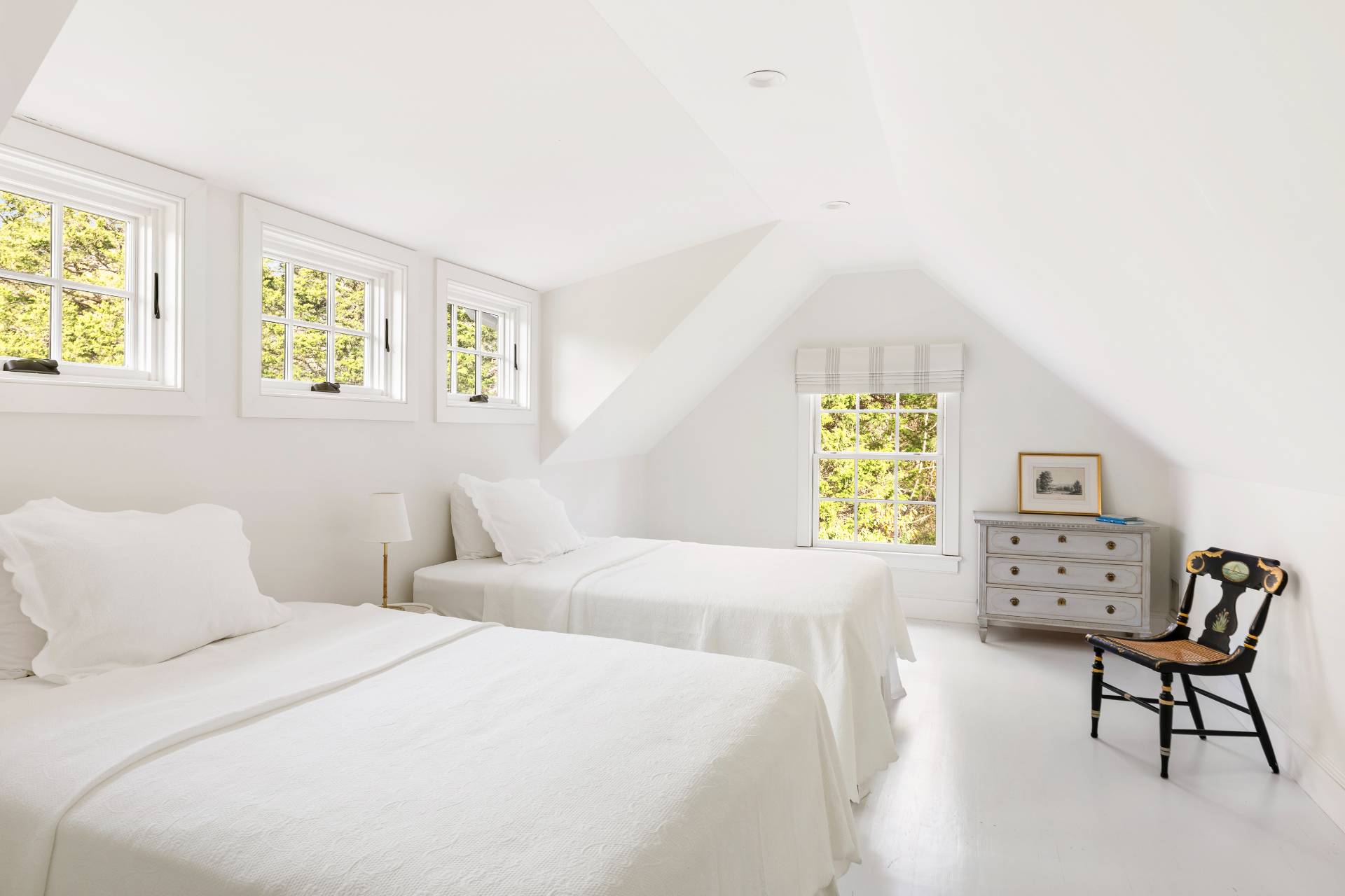 267 Meadows West Bridgehampton, NY 11932 - Photo 15 of 27 a bedroom with a bed a couch and a window