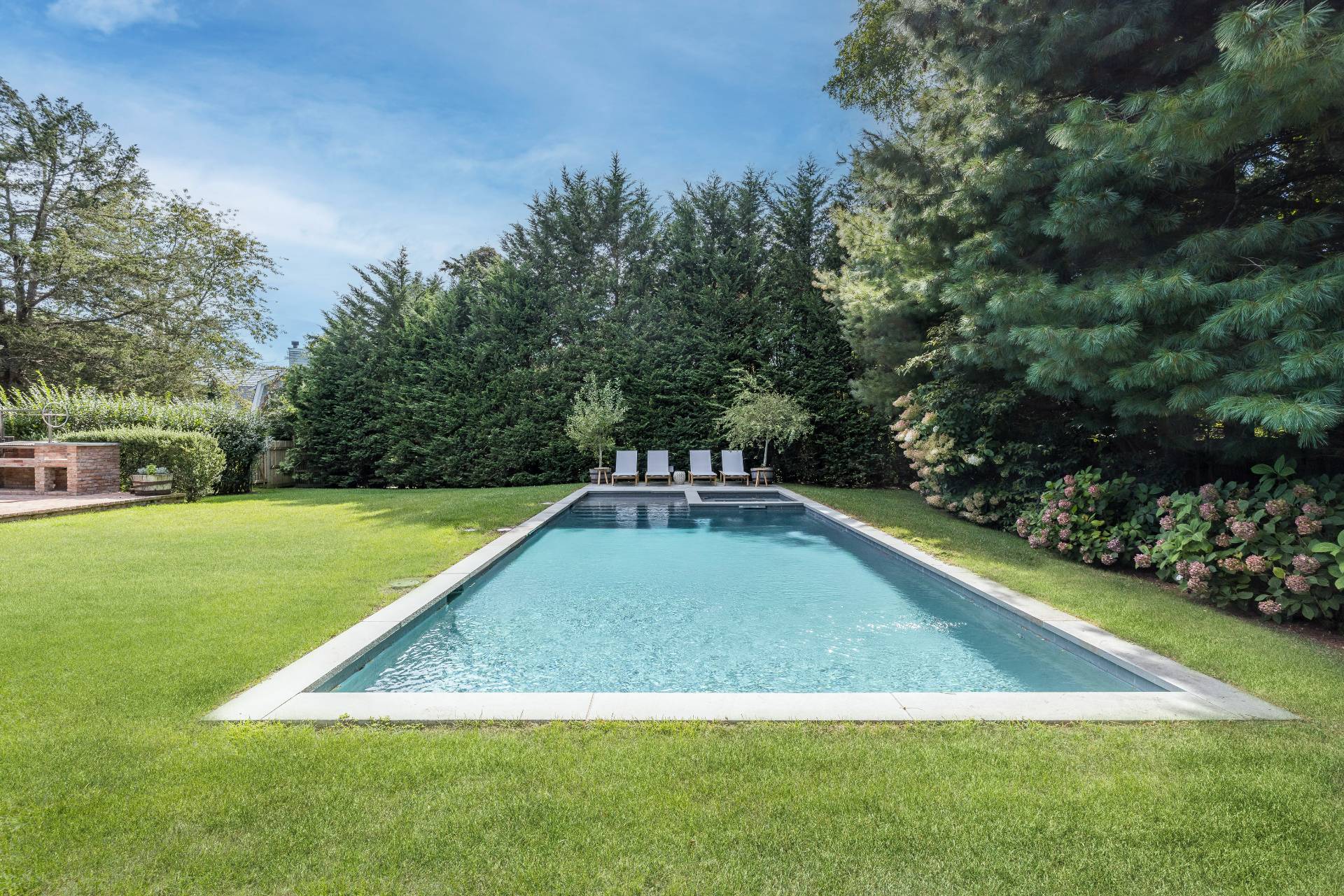 267 Meadows West Bridgehampton, NY 11932 - Photo 2 of 27 a view of a swimming pool with a yard