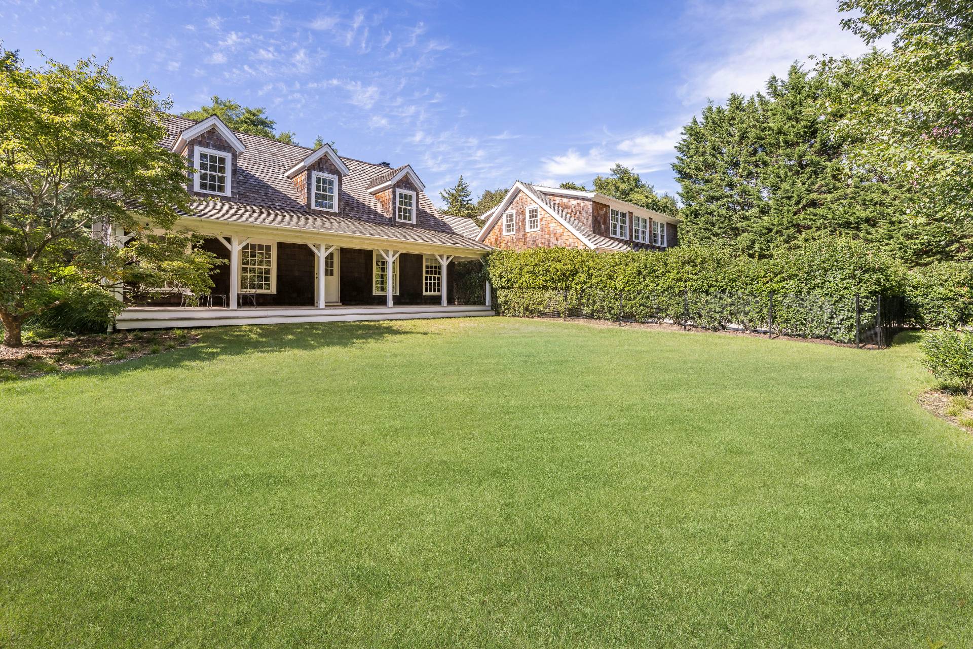 267 Meadows West Bridgehampton, NY 11932 - Photo 4 of 27 a front view of house with yard and green space
