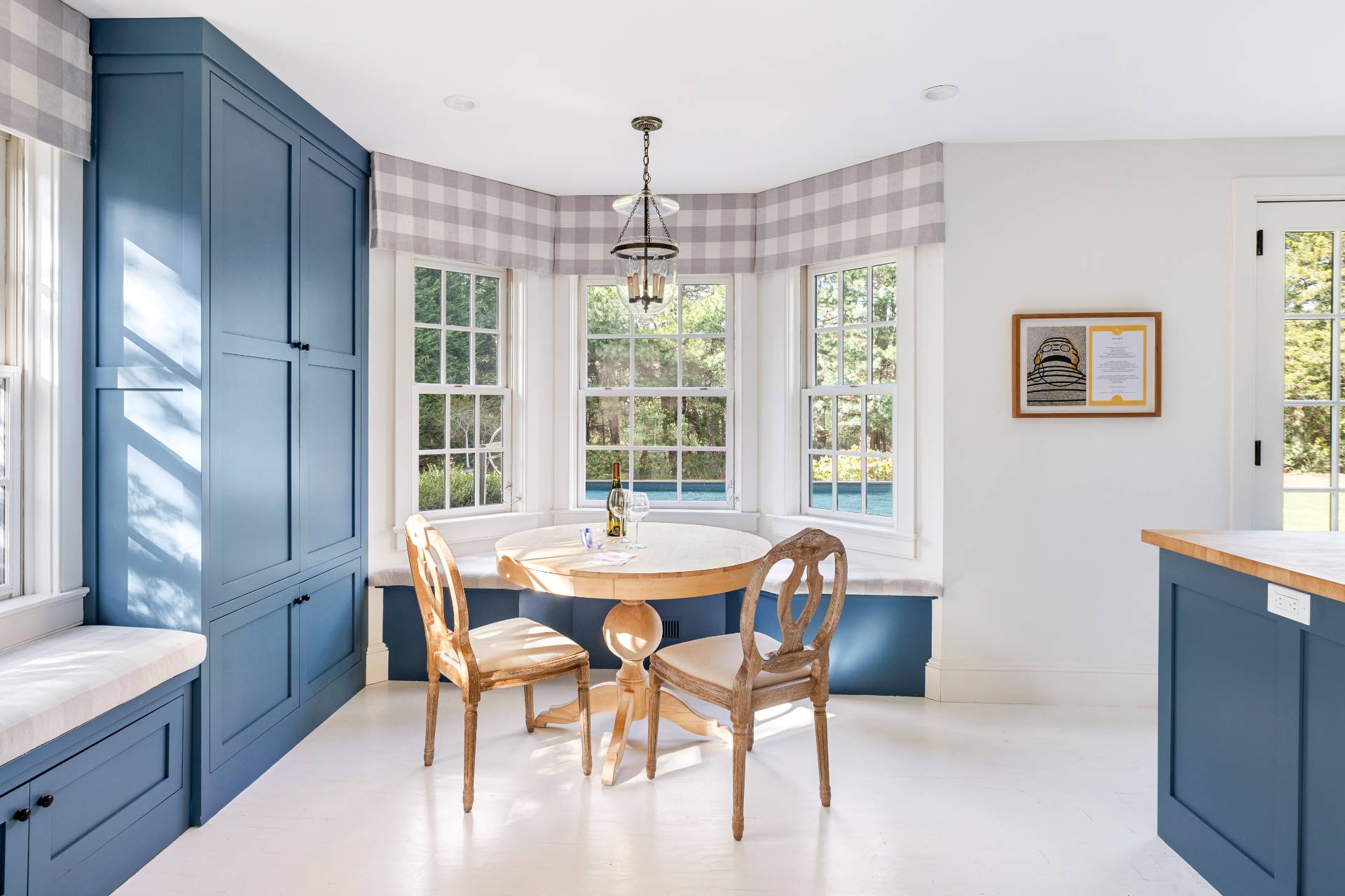 267 Meadows West Bridgehampton, NY 11932 - Photo 8 of 27 a dining room with furniture a chandelier and wooden floor