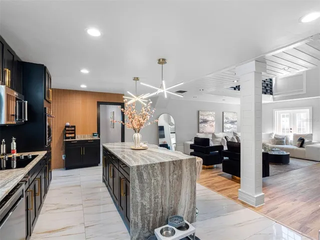 a kitchen with a sink stove and refrigerator