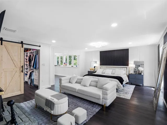 a bedroom with a bed and furniture