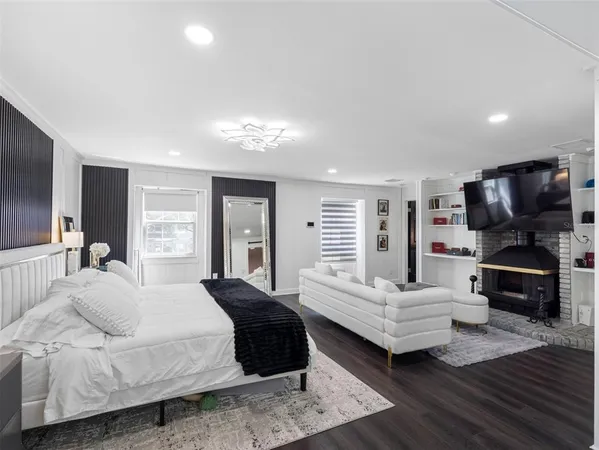 a bedroom with a bed and a couch