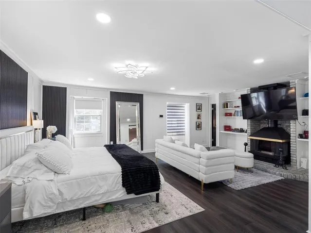 a bedroom with a bed and a couch