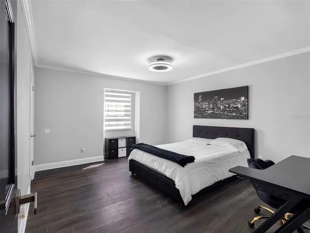 a open kitchen with stainless steel appliances granite countertop a sink a stove and a wooden floors