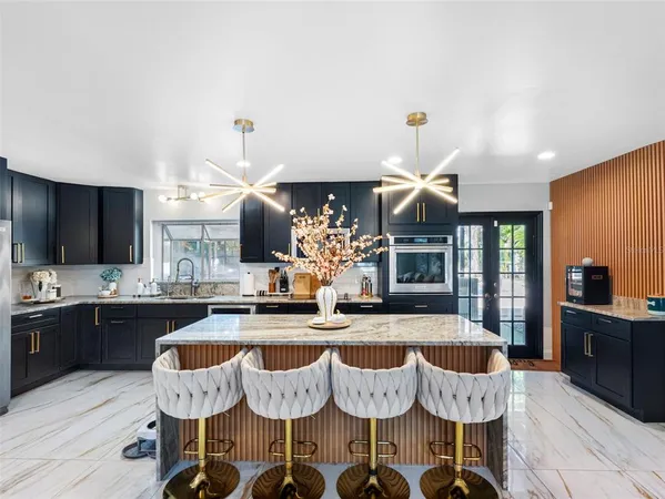 a kitchen with granite countertop lots of counter top space and dining table