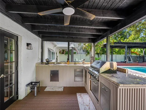 a view of a backyard with sitting area