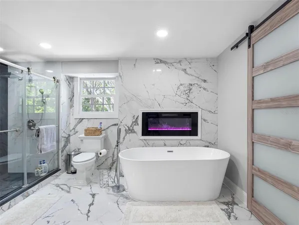 a bathroom with a bathtub and sink