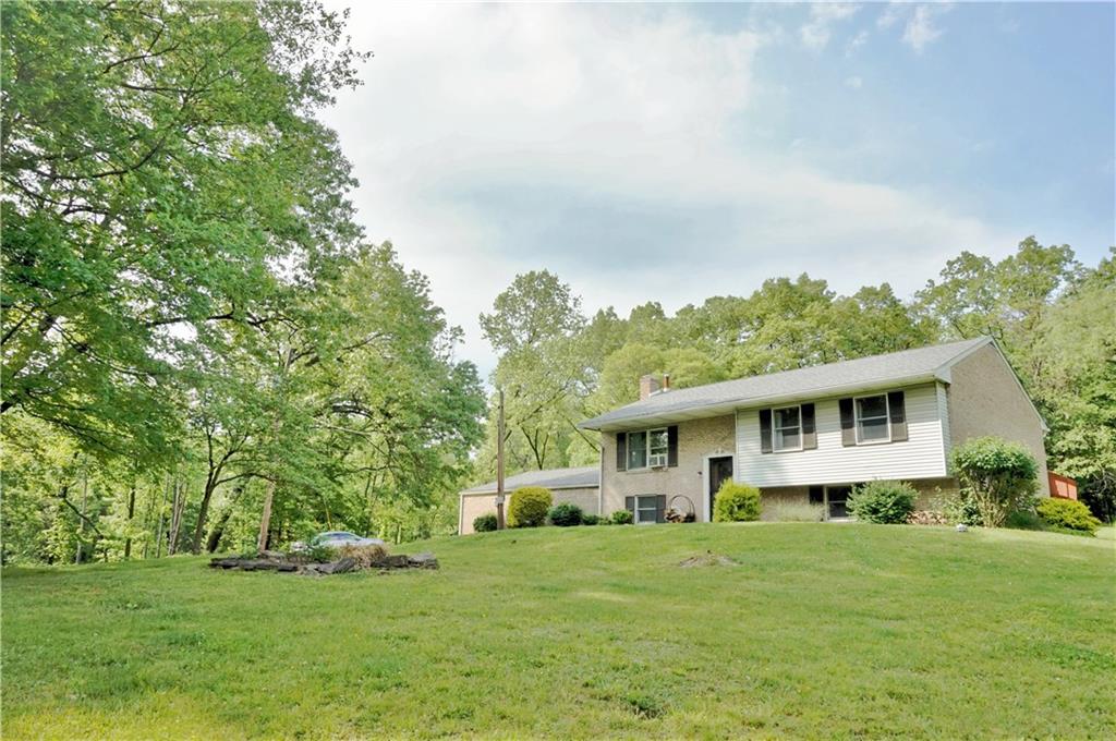 4076 Glasgow Road Valencia, PA 16059 - Photo 1 of 20 Positioned on the crest of the 10+ acres, this custom split offers the privacy you desire!