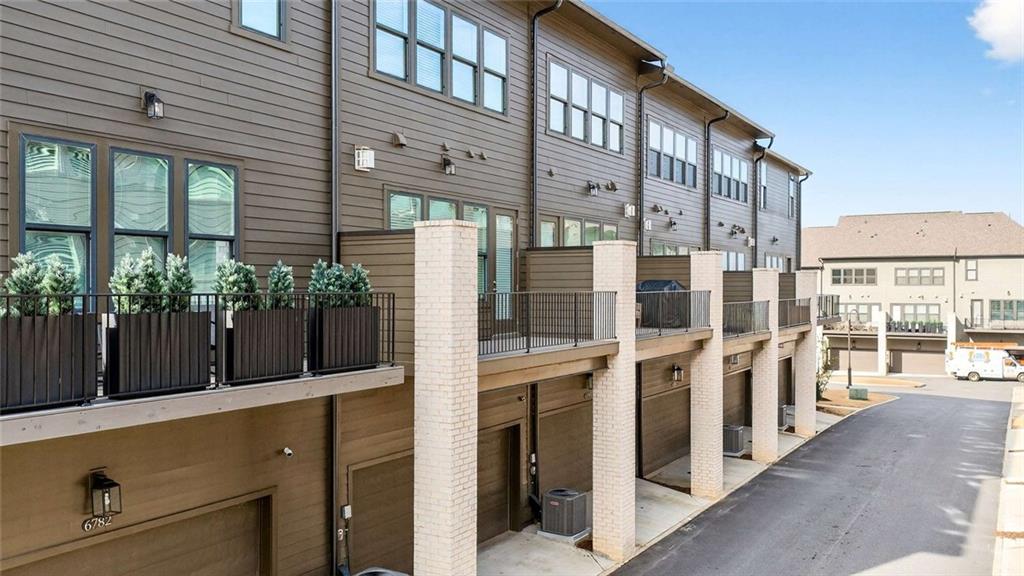 6786 Encore Boulevard Atlanta, GA 30328 - Photo 22 of 31 a view of a building with a potted plant
