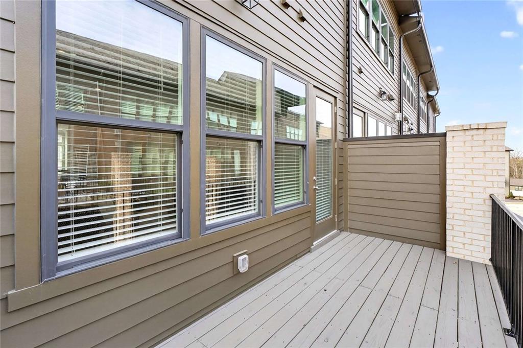 6786 Encore Boulevard Atlanta, GA 30328 - Photo 23 of 31 a view of a house with a roof deck