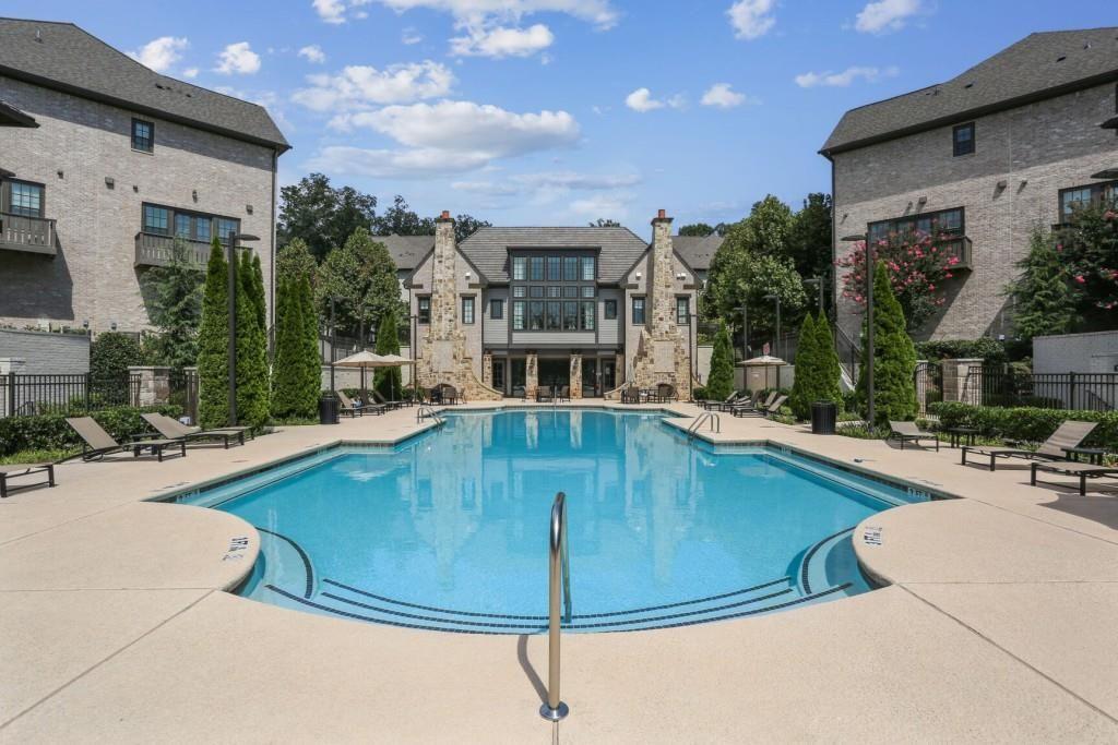 6786 Encore Boulevard Atlanta, GA 30328 - Photo 24 of 31 a view of a swimming pool with a patio
