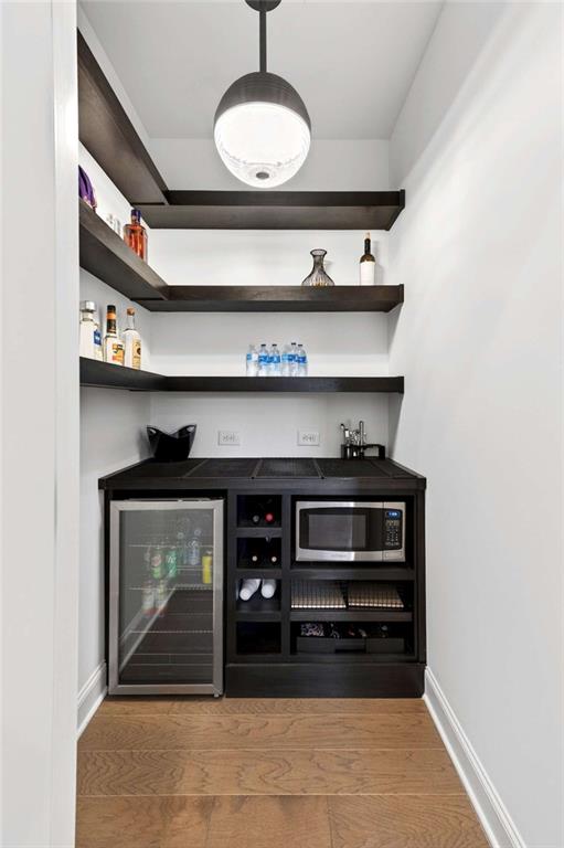 6786 Encore Boulevard Atlanta, GA 30328 - Photo 9 of 31 a stove top oven sitting inside of a kitchen