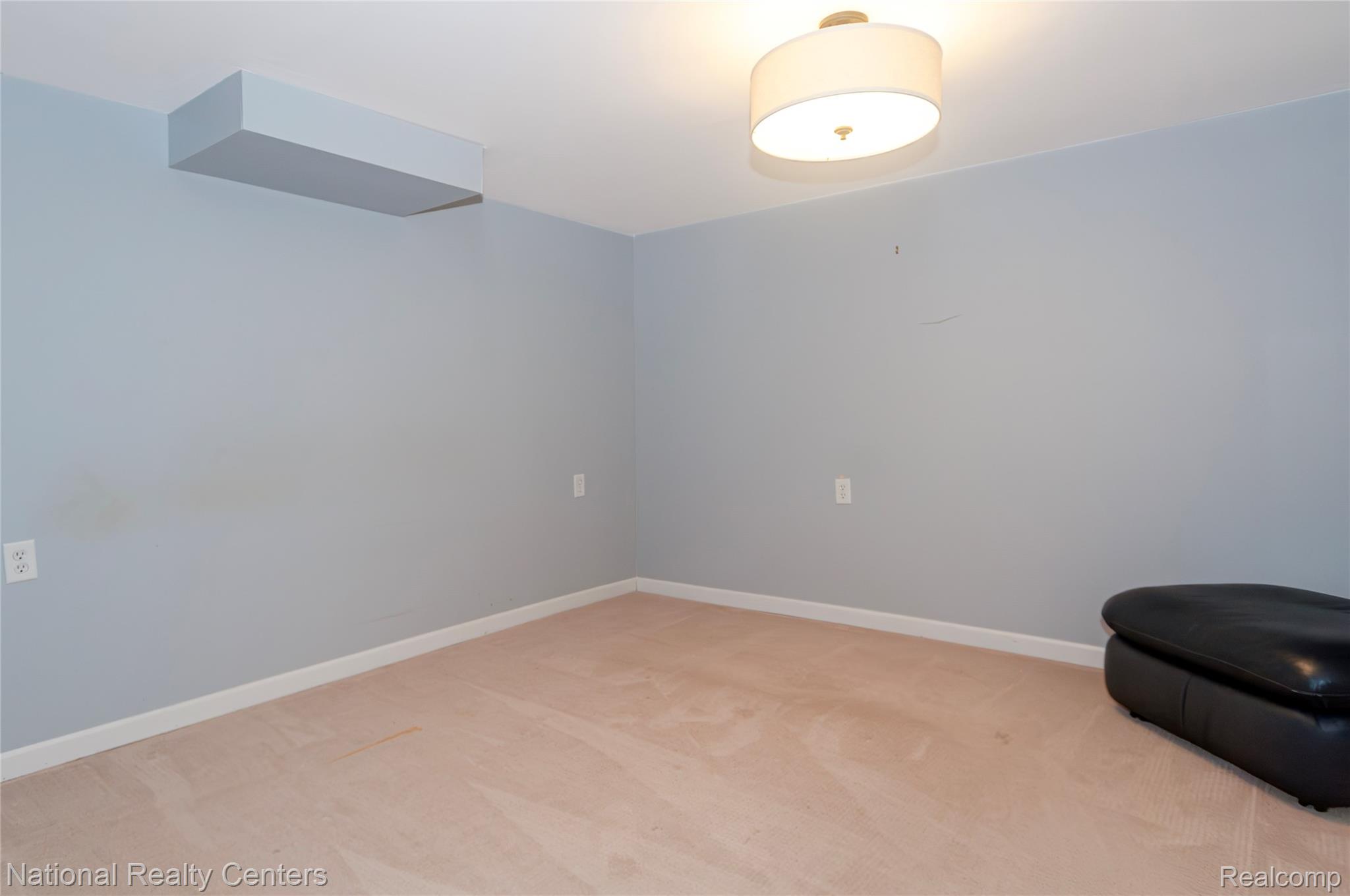 2446 Milverton Road Troy, MI 48083 - Photo 27 of 41 Unfurnished room with light colored carpet and baseboards