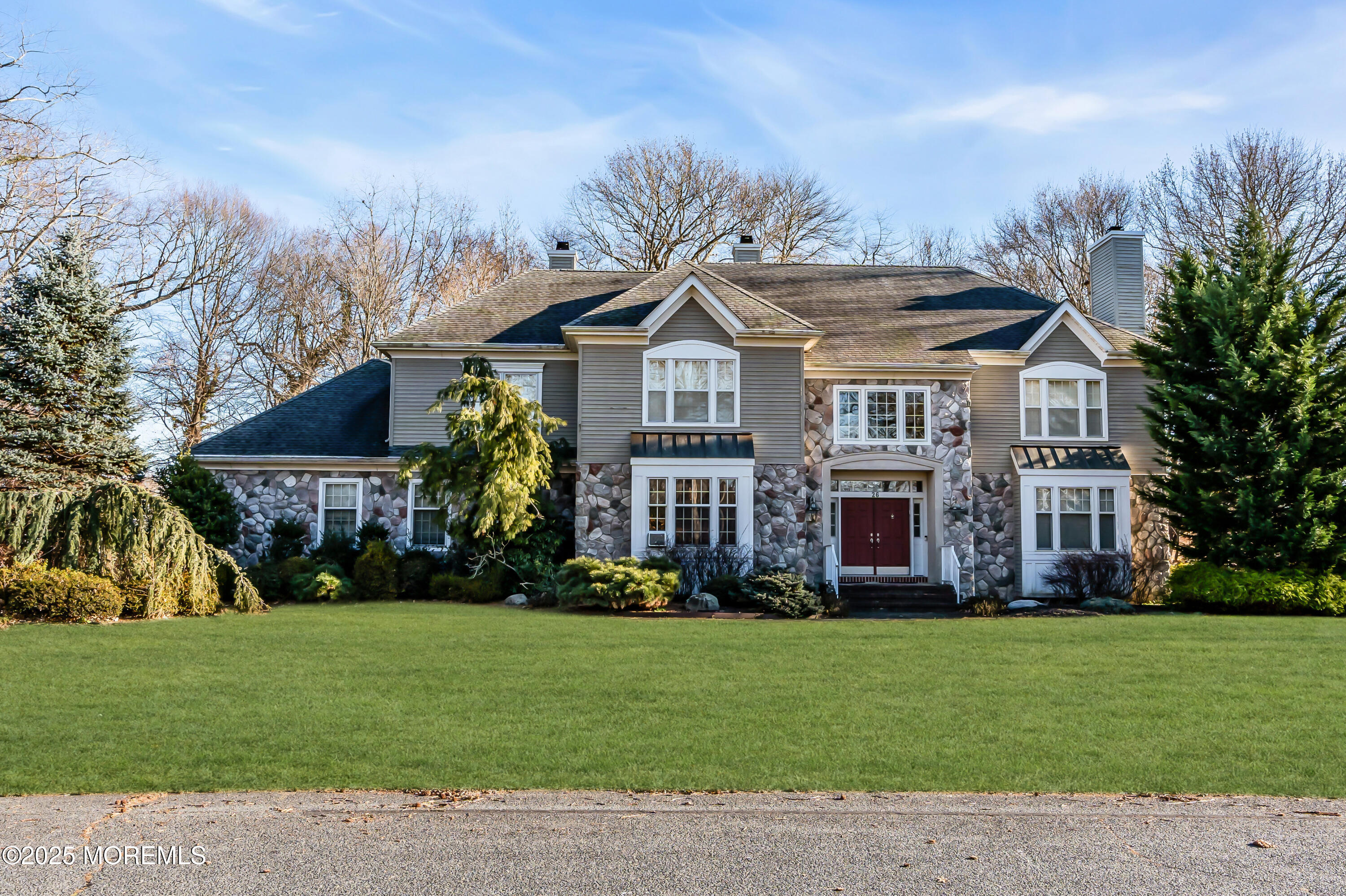 a front view of house with yard and green space