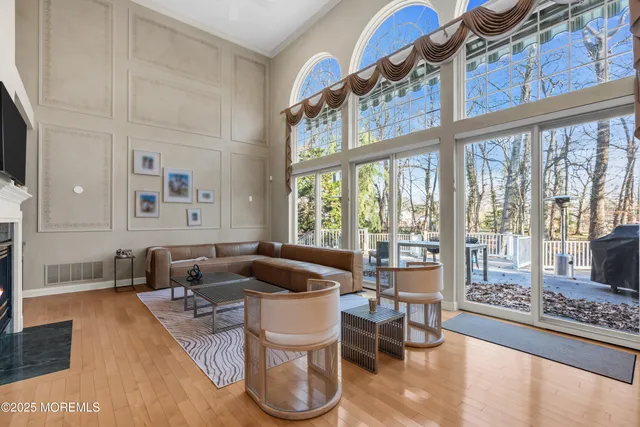 a view of a dining room with furniture wooden floor and chandelier
