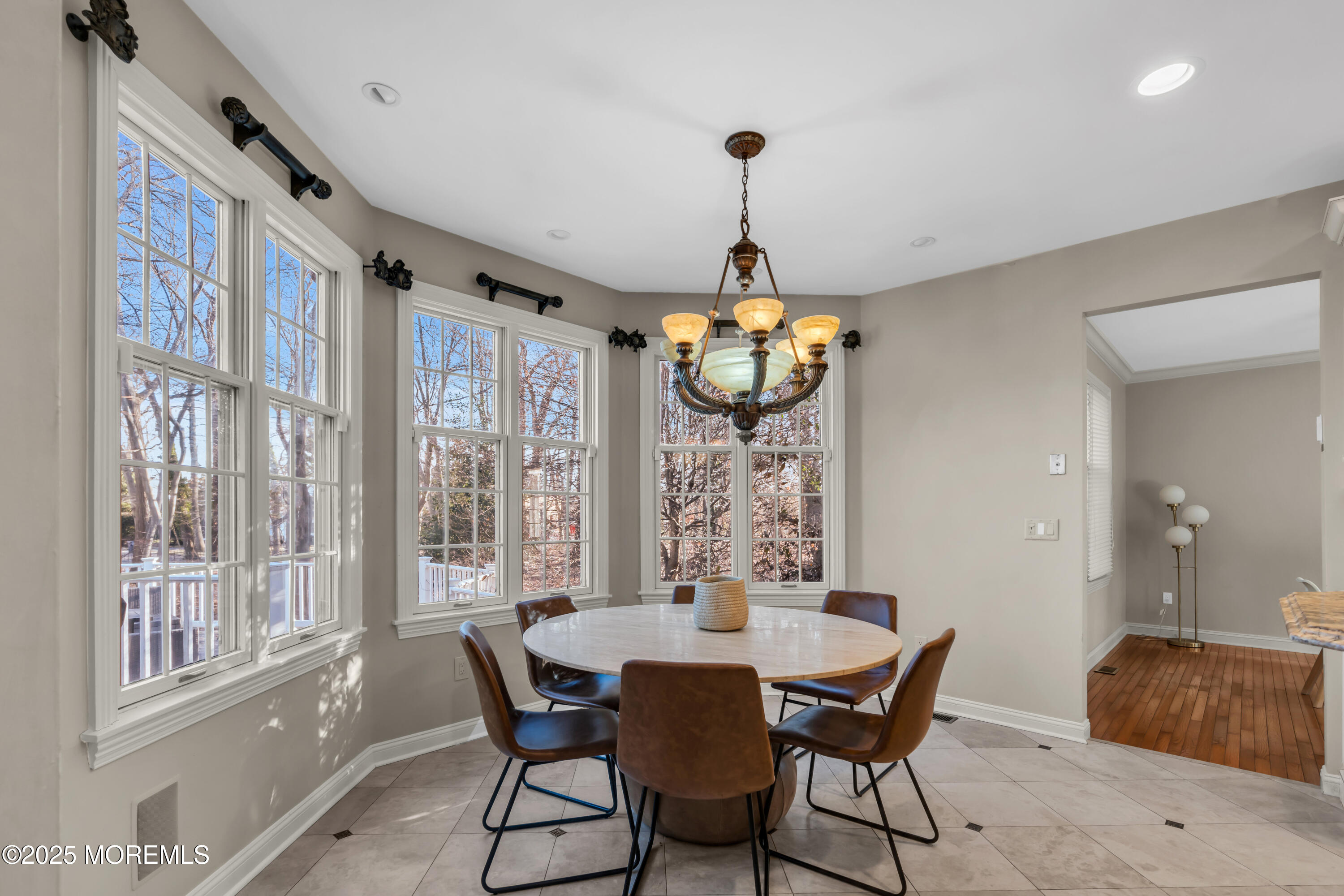 26 Bruns Road Allenhurst, NJ 07711 - Photo 17 of 82 a view of a dining room with furniture wooden floor and chandelier