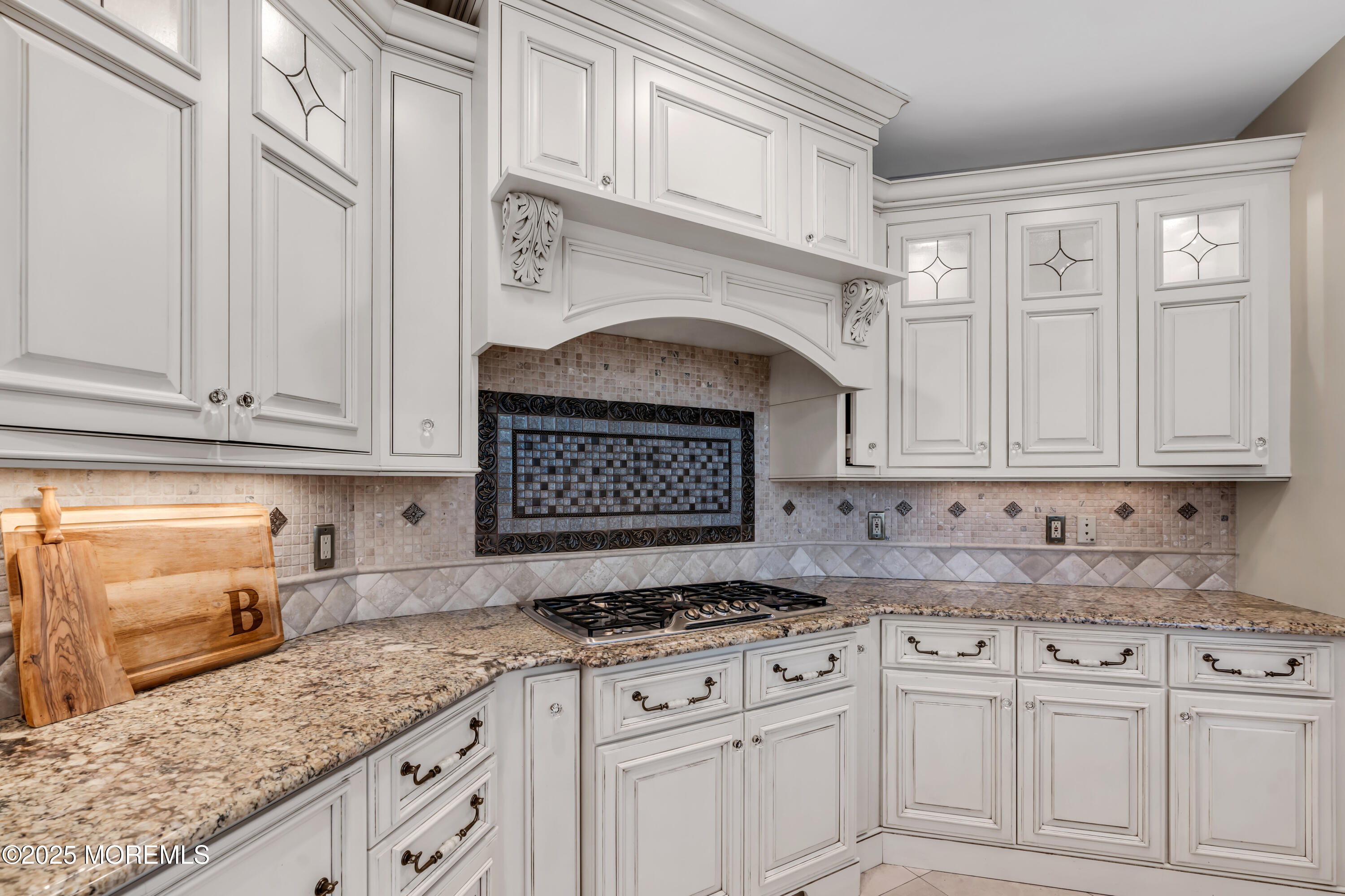 26 Bruns Road Allenhurst, NJ 07711 - Photo 20 of 82 a kitchen with granite countertop white cabinets and white appliances