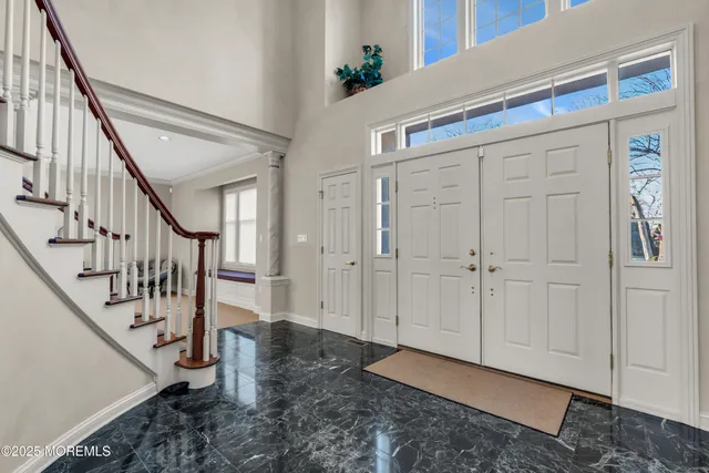 a bathroom with a granite countertop sink and mirror