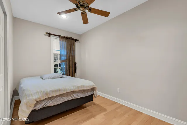 a view of living room with furniture and wooden floor