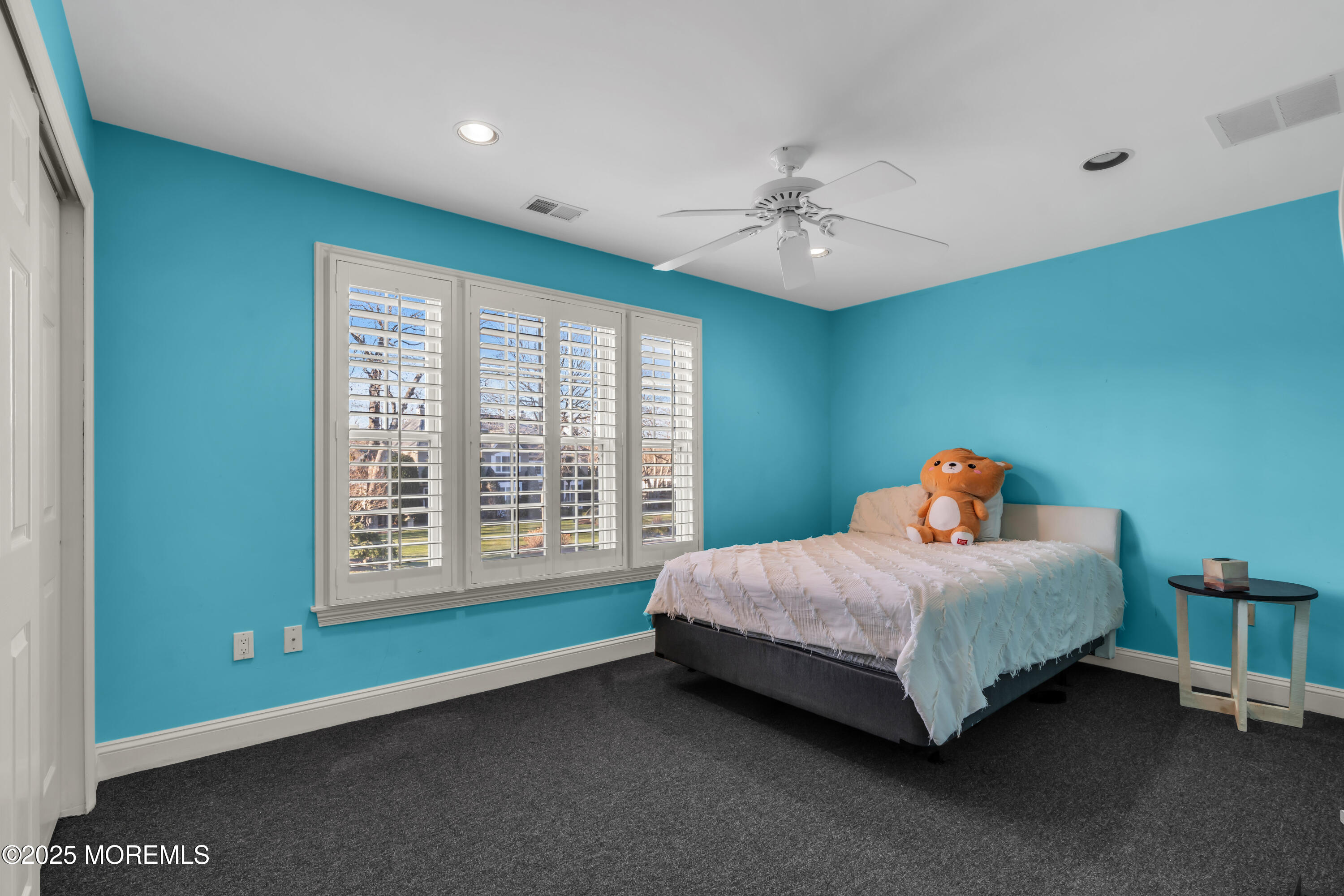 26 Bruns Road Allenhurst, NJ 07711 - Photo 42 of 82 a bedroom with a bed and a chandelier