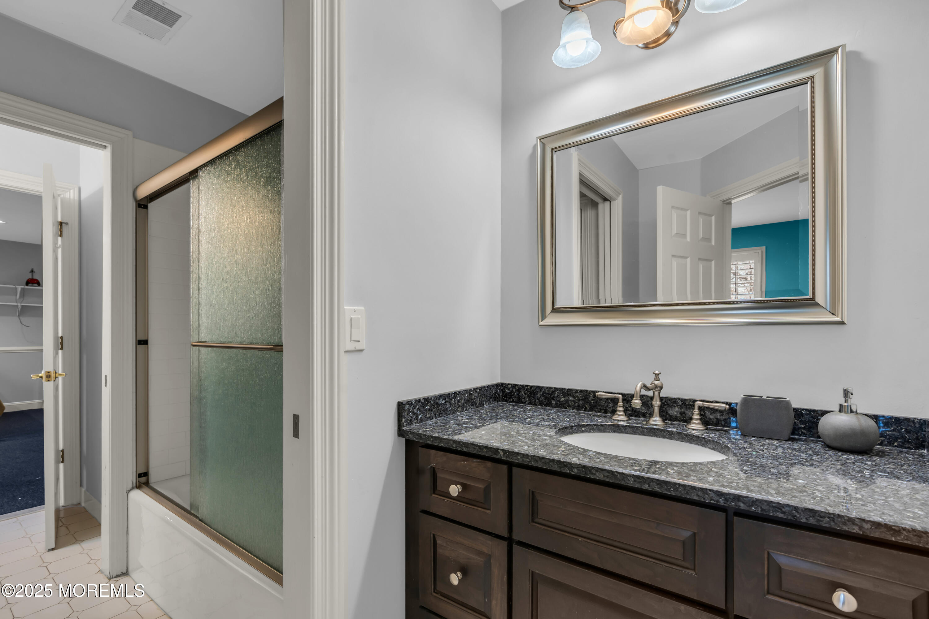 26 Bruns Road Allenhurst, NJ 07711 - Photo 44 of 82 a bathroom with a granite countertop sink and mirror