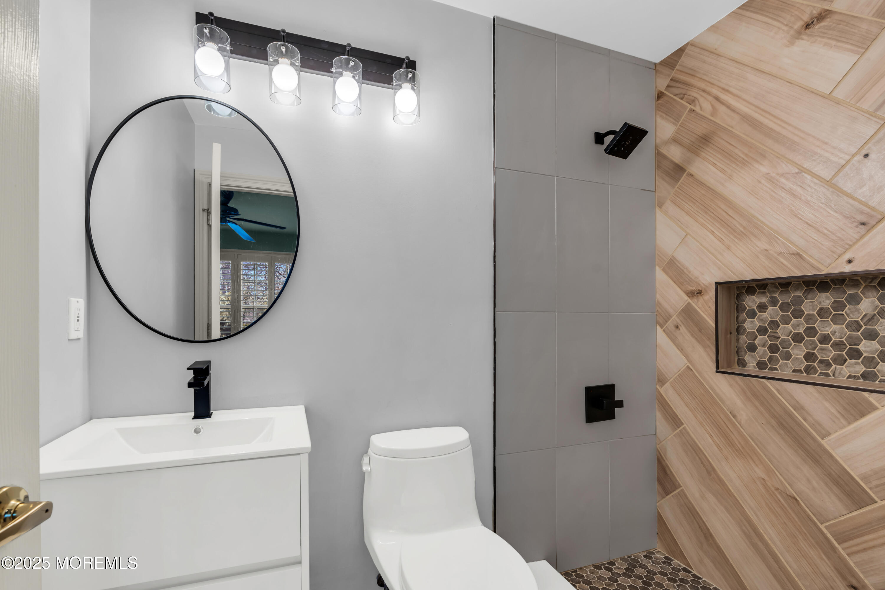 26 Bruns Road Allenhurst, NJ 07711 - Photo 49 of 82 a bathroom with a toilet a sink and a mirror