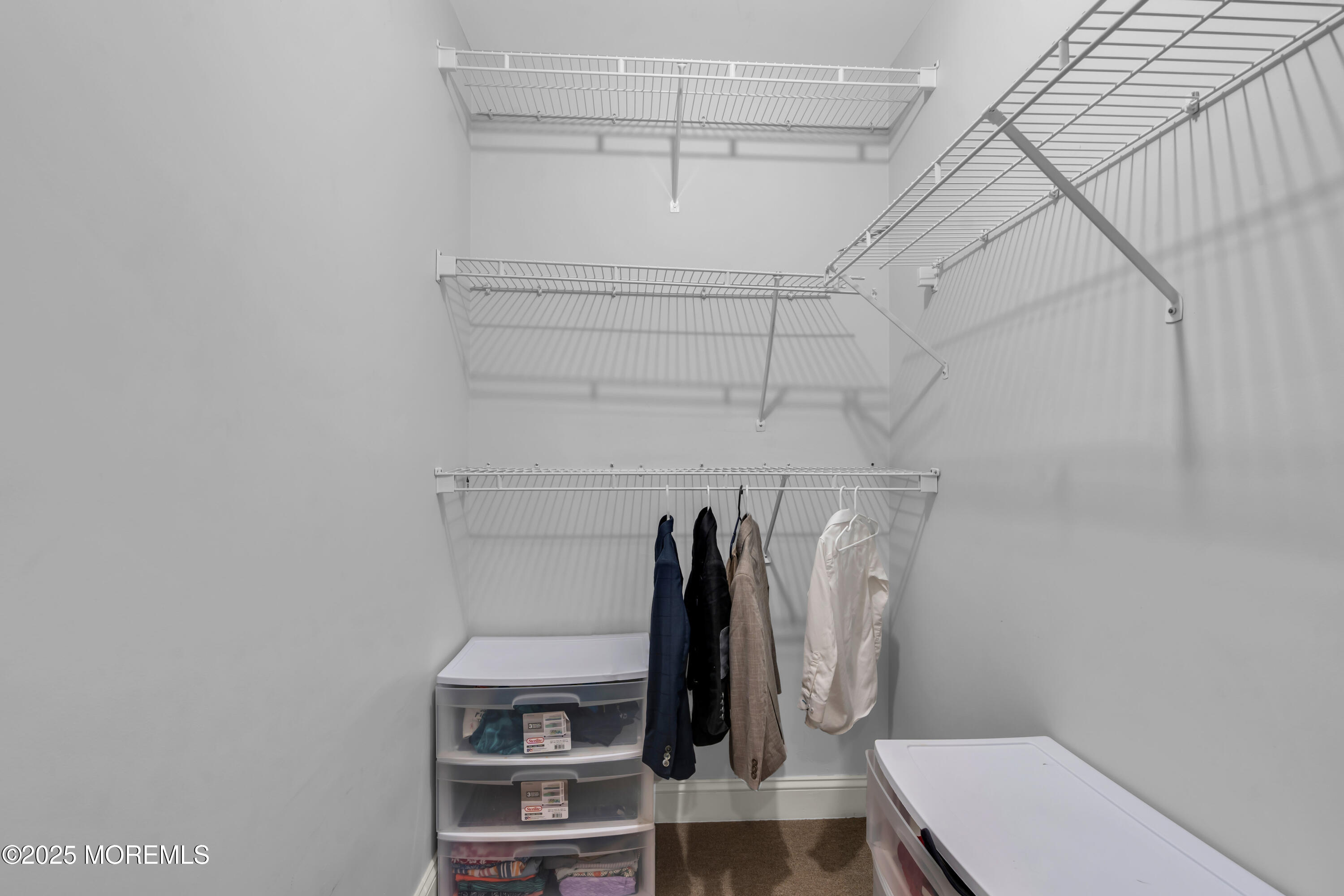 26 Bruns Road Allenhurst, NJ 07711 - Photo 50 of 82 a view of walk in closet with clothes and shoes