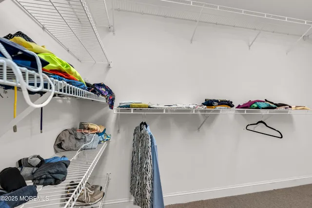 a view of backyard with a deck and furniture