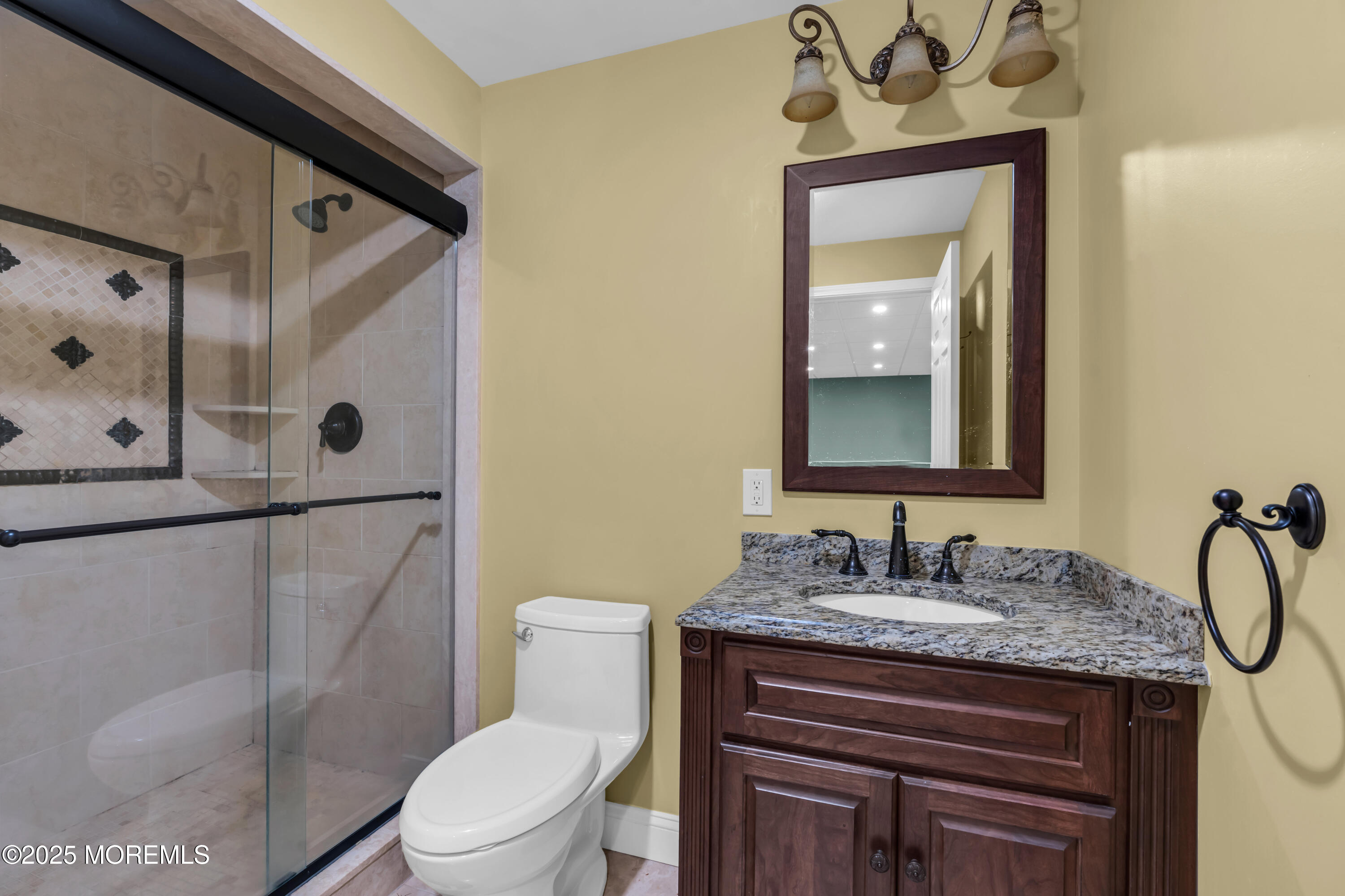 26 Bruns Road Allenhurst, NJ 07711 - Photo 68 of 82 a bathroom with a granite countertop sink toilet and mirror
