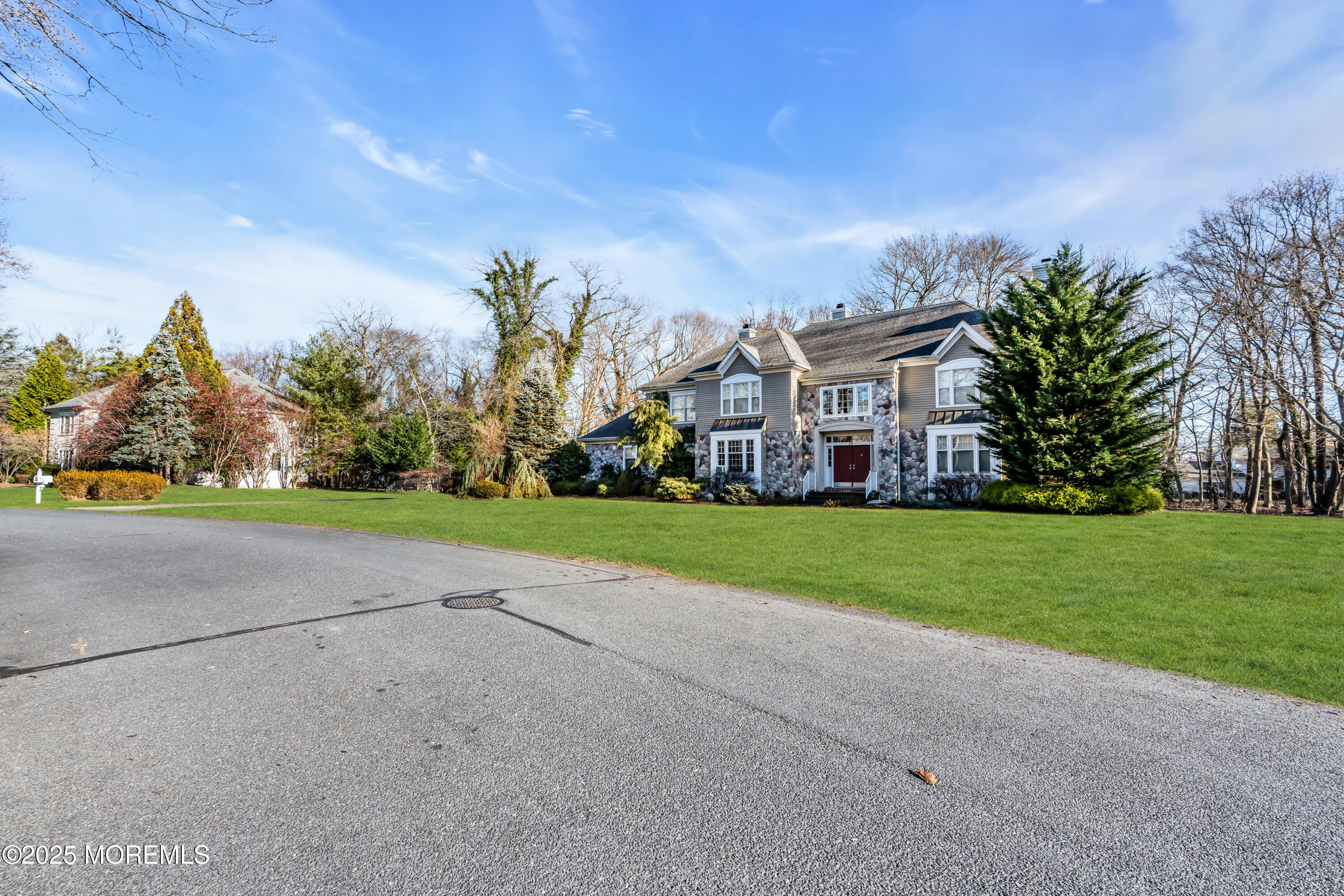 26 Bruns Road Allenhurst, NJ 07711 - Photo 7 of 82 a view of a big house with a big yard and large trees