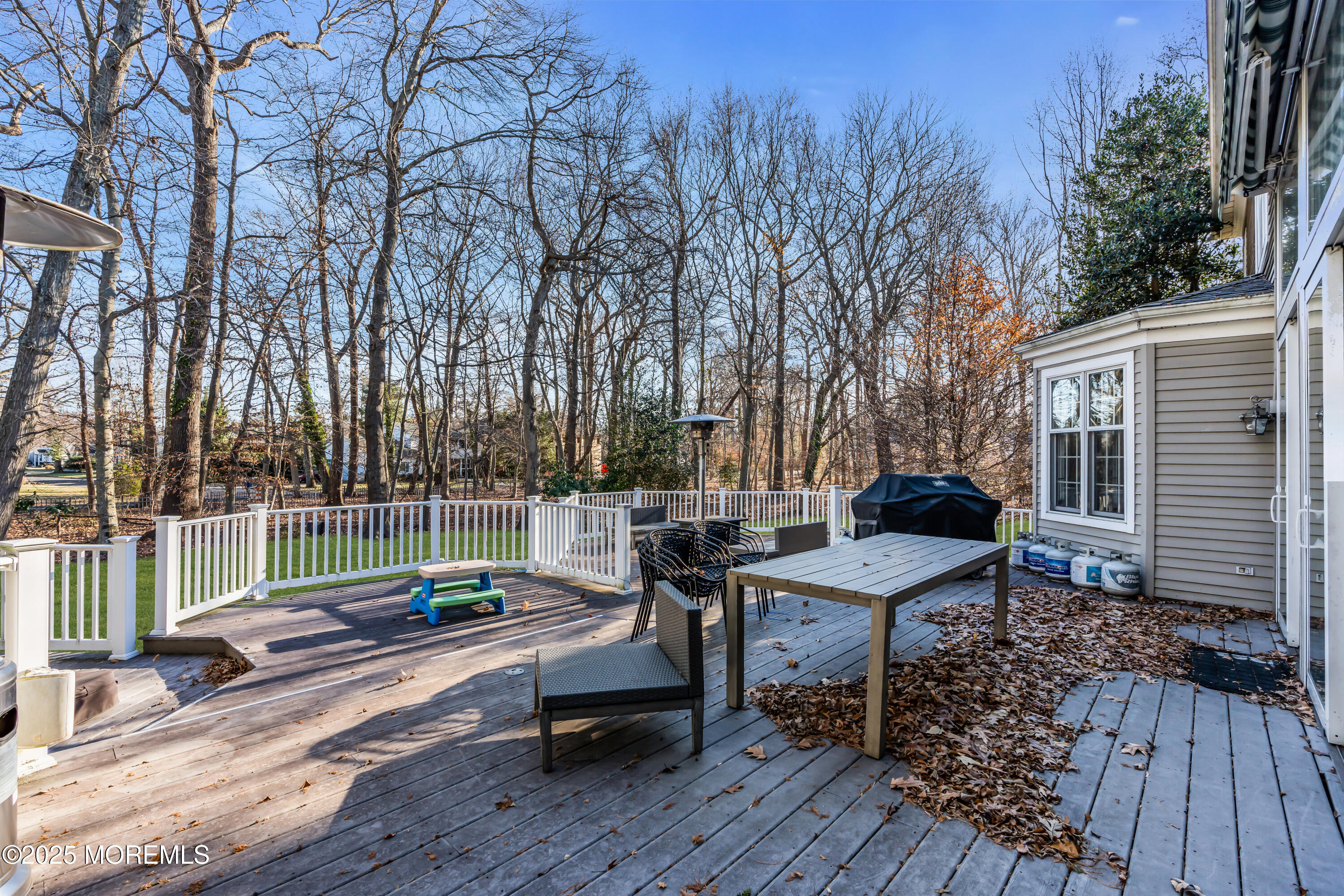 26 Bruns Road Allenhurst, NJ 07711 - Photo 78 of 82 a view of a chairs and table on the wooden deck