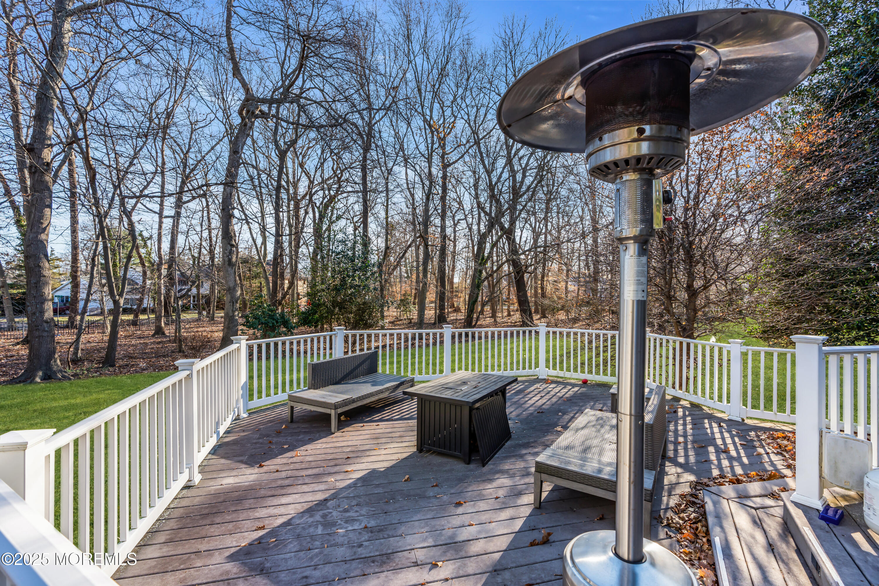 26 Bruns Road Allenhurst, NJ 07711 - Photo 80 of 82 a view of a deck with couches table and chairs and wooden floor