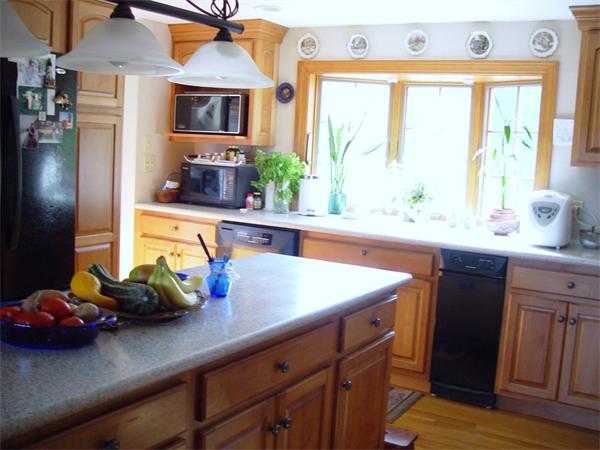 338 Ware Corner Road Oakham, MA 01068 - Photo 15 of 20 a kitchen with stainless steel appliances a sink a counter space and a window