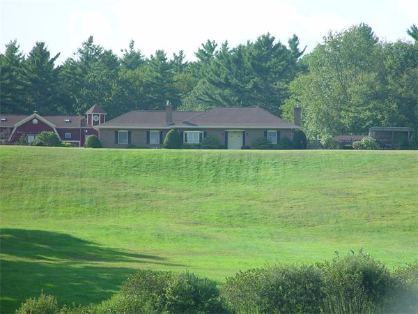 338 Ware Corner Road Oakham, MA 01068 - Photo 3 of 20 a front view of a house with a yard