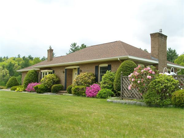338 Ware Corner Road Oakham, MA 01068 - Photo 4 of 20 a front view of house with garden