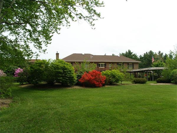 338 Ware Corner Road Oakham, MA 01068 - Photo 7 of 20 a view of a garden with a house