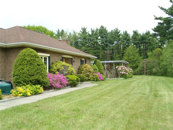 338 Ware Corner Road Oakham, MA 01068 - Photo 10 of 20 a front view of a house with garden