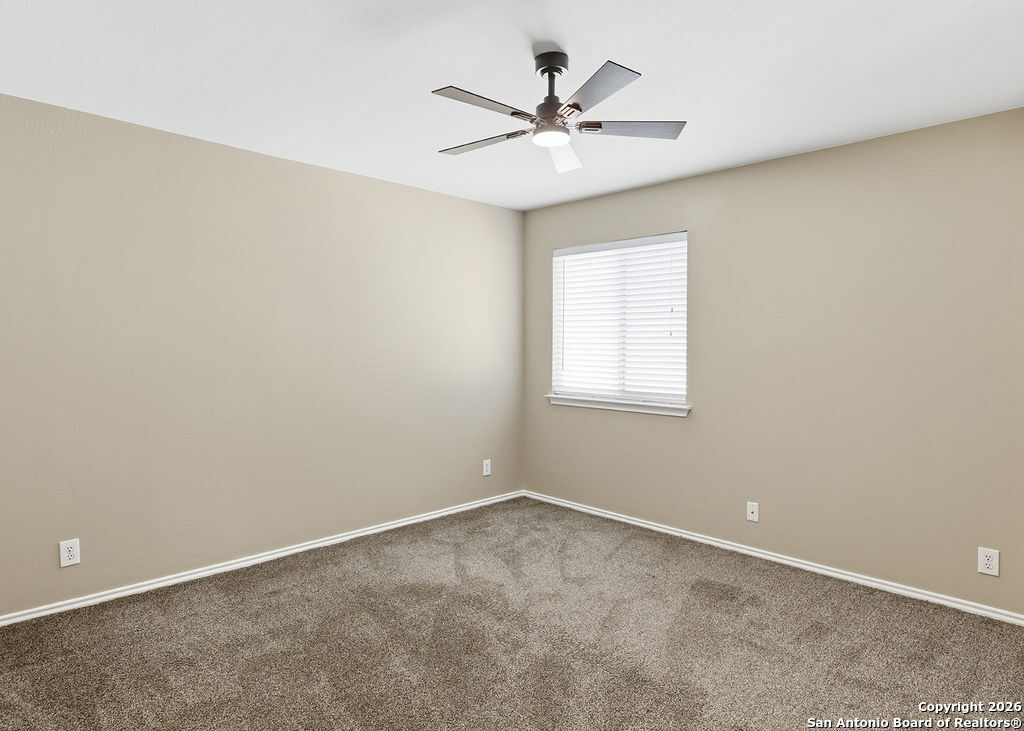 8905 Pinseeker Selma, TX 78154 - Photo 12 of 23 an empty room with a window and a fan