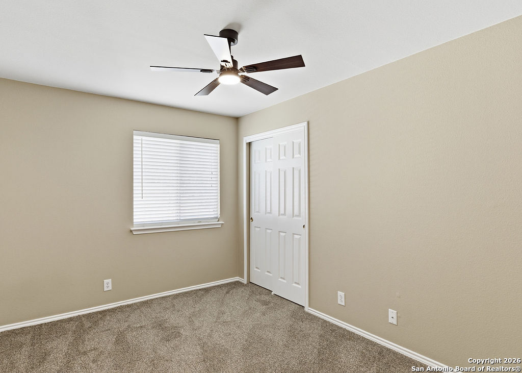 8905 Pinseeker Selma, TX 78154 - Photo 13 of 23 a view of an empty room with a window