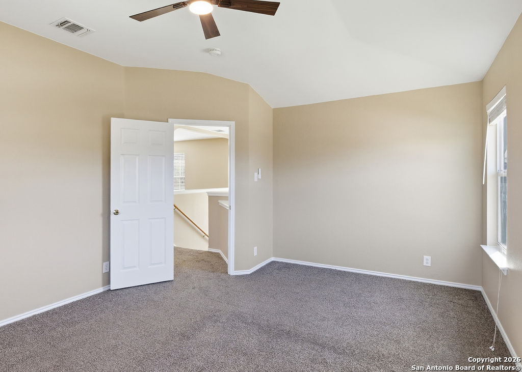 8905 Pinseeker Selma, TX 78154 - Photo 15 of 23 an empty room with a empty space and a ceiling fan