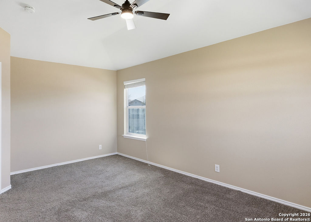 8905 Pinseeker Selma, TX 78154 - Photo 16 of 23 an empty room with windows and fan