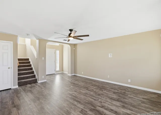 a view of wooden floor and staircase in a room