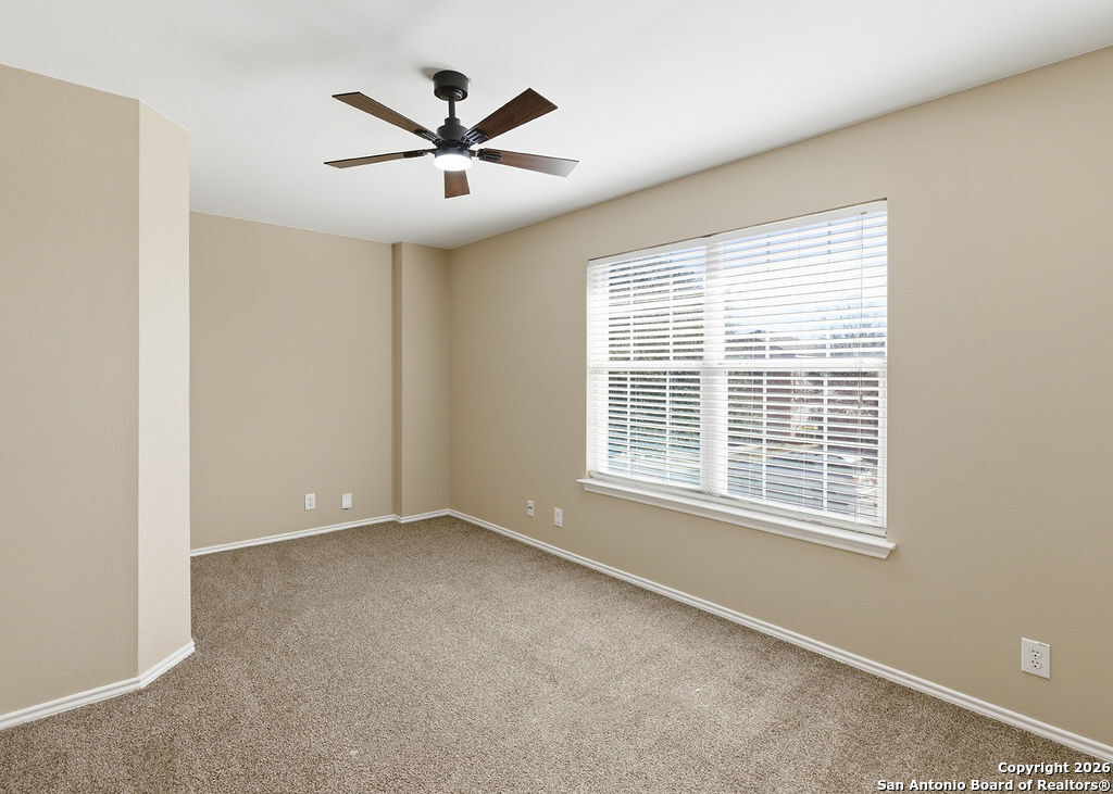 8905 Pinseeker Selma, TX 78154 - Photo 10 of 23 a view of an empty room with a window
