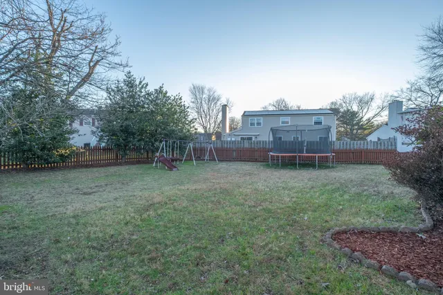 a kitchen with stainless steel appliances a refrigerator and a stove top oven