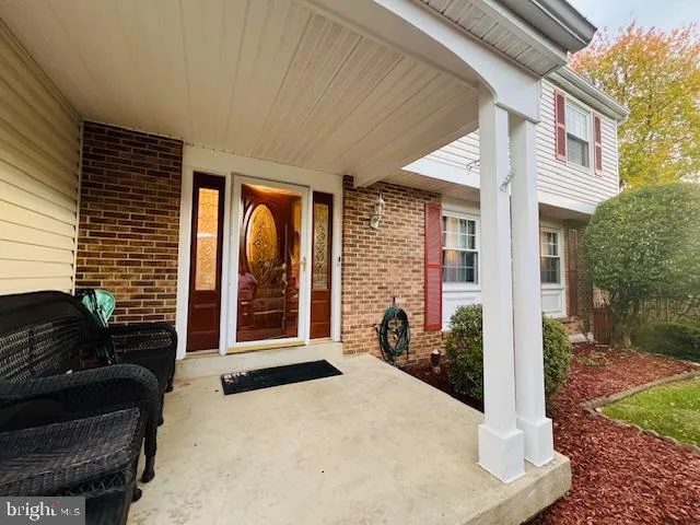 a front view of a building with small garden