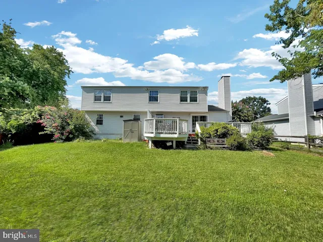 a front view of a house with sitting area