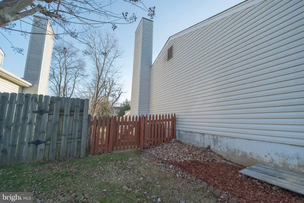 a view of backyard with a deck and wooden floor